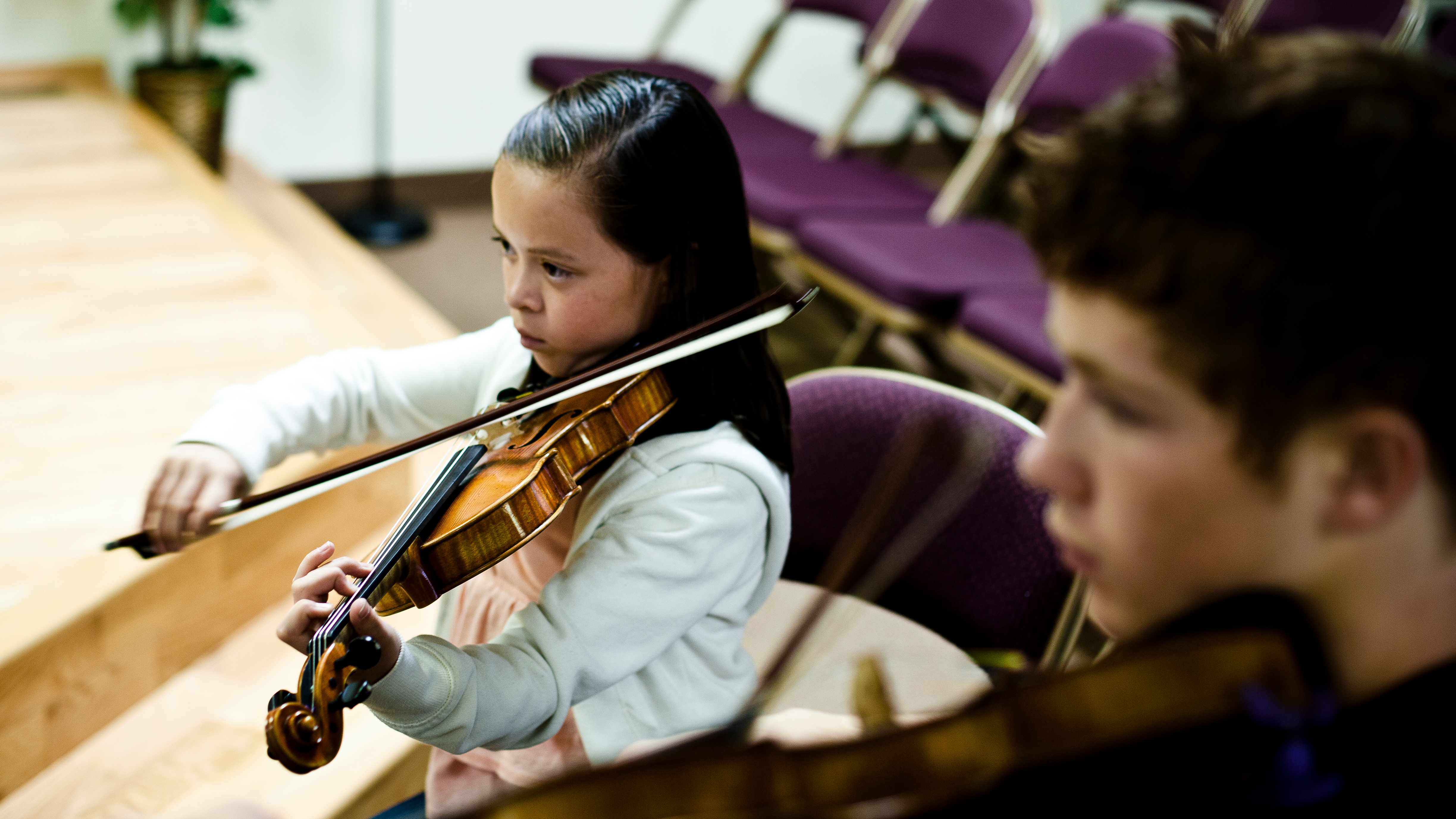 Young child taking violin lesson in salt lake city at Gifted Music School